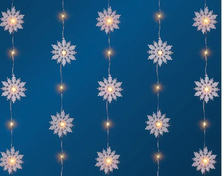 TrendLine LED-Lichtervorhang Schneeflocken Innen 60 x 150 cm warmweiß mit Timer TrendLine LED-Lichtervorhang Schneeflocken Innen 60 x 150 cm warmweiß mit Timer