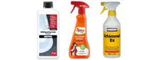 Drei verschiedene Sprühflaschen für den Haushalt: linker Flasche mit Abflussreiniger, mittig ein Fettlöser mit rotem Sprühkopf, rechts ein Schimmel-Ex Spray mit gelbem Etikett.