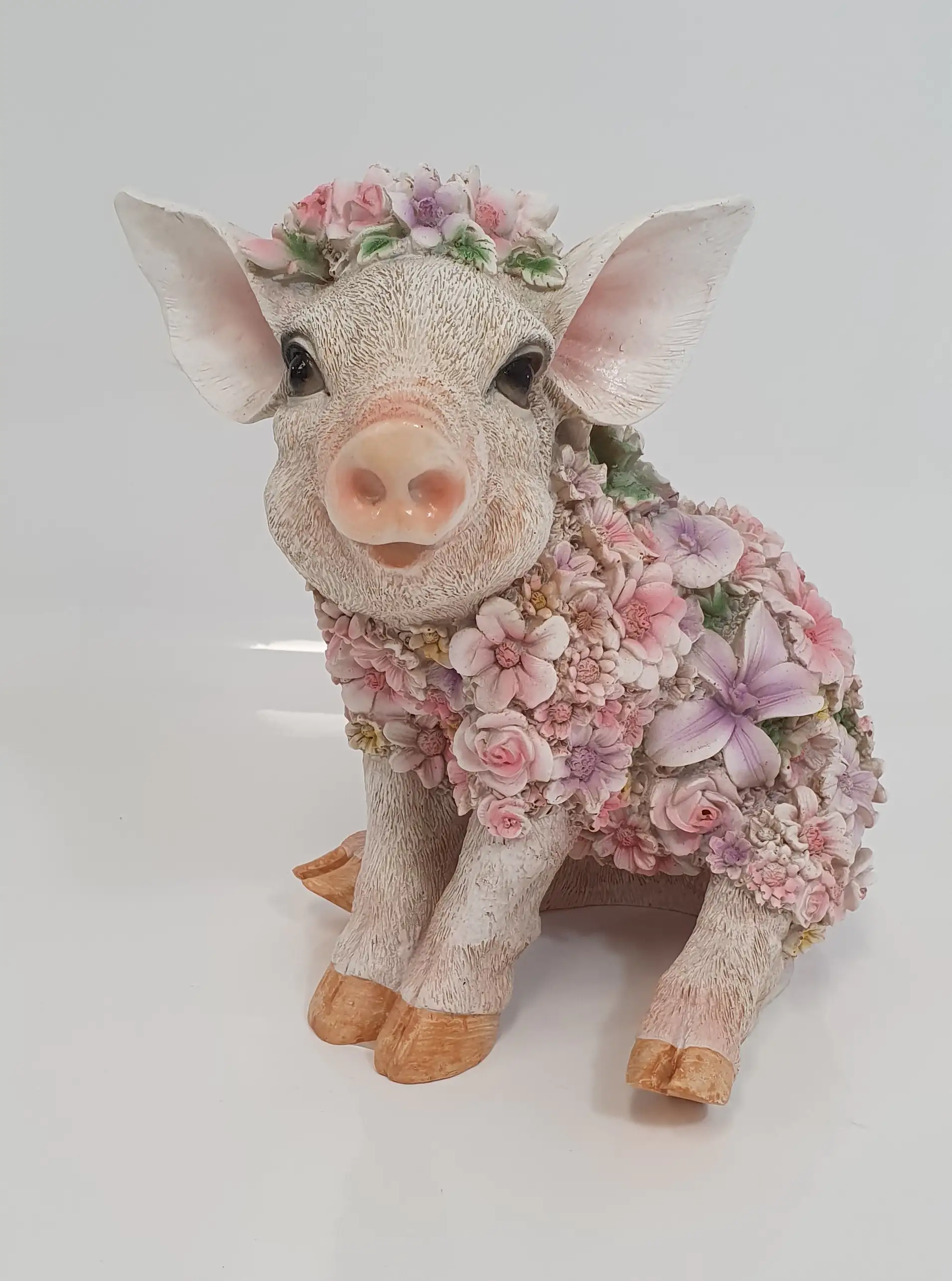 Dekofigur Blumenschwein sitzend 18x 24 cm